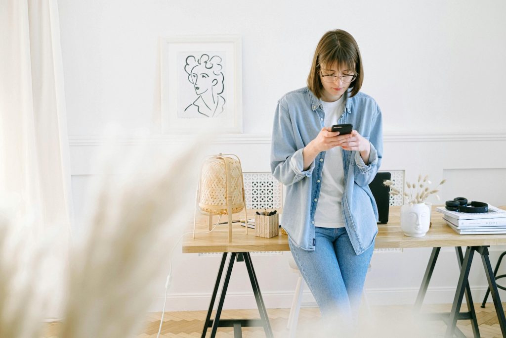 email marketing automation strategy woman sending an email on her phone